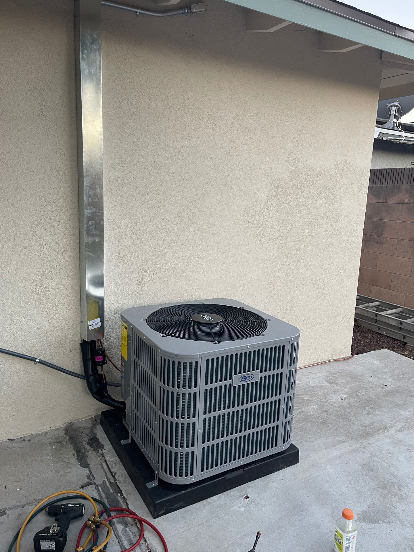 Clean side-yard AC condenser install with sealed lineset chase
